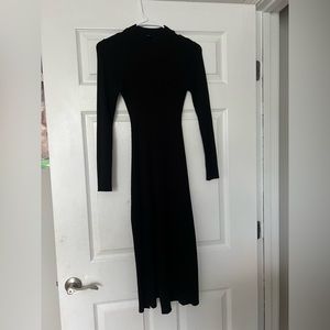 Black bodycon dress with a slit in the front. Very pretty dress, worn 3 times